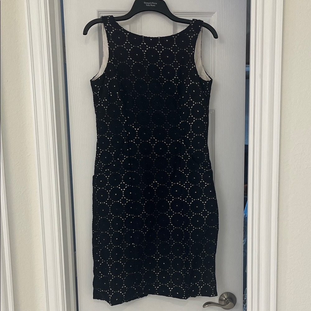ANTONIO MELANI Black dress, tan under lining. Pockets on front & back of dress.